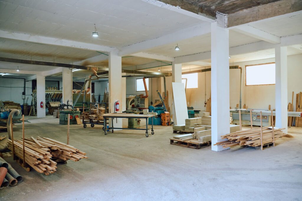 Interior of a custom shop with storage, tools, and natural lighting